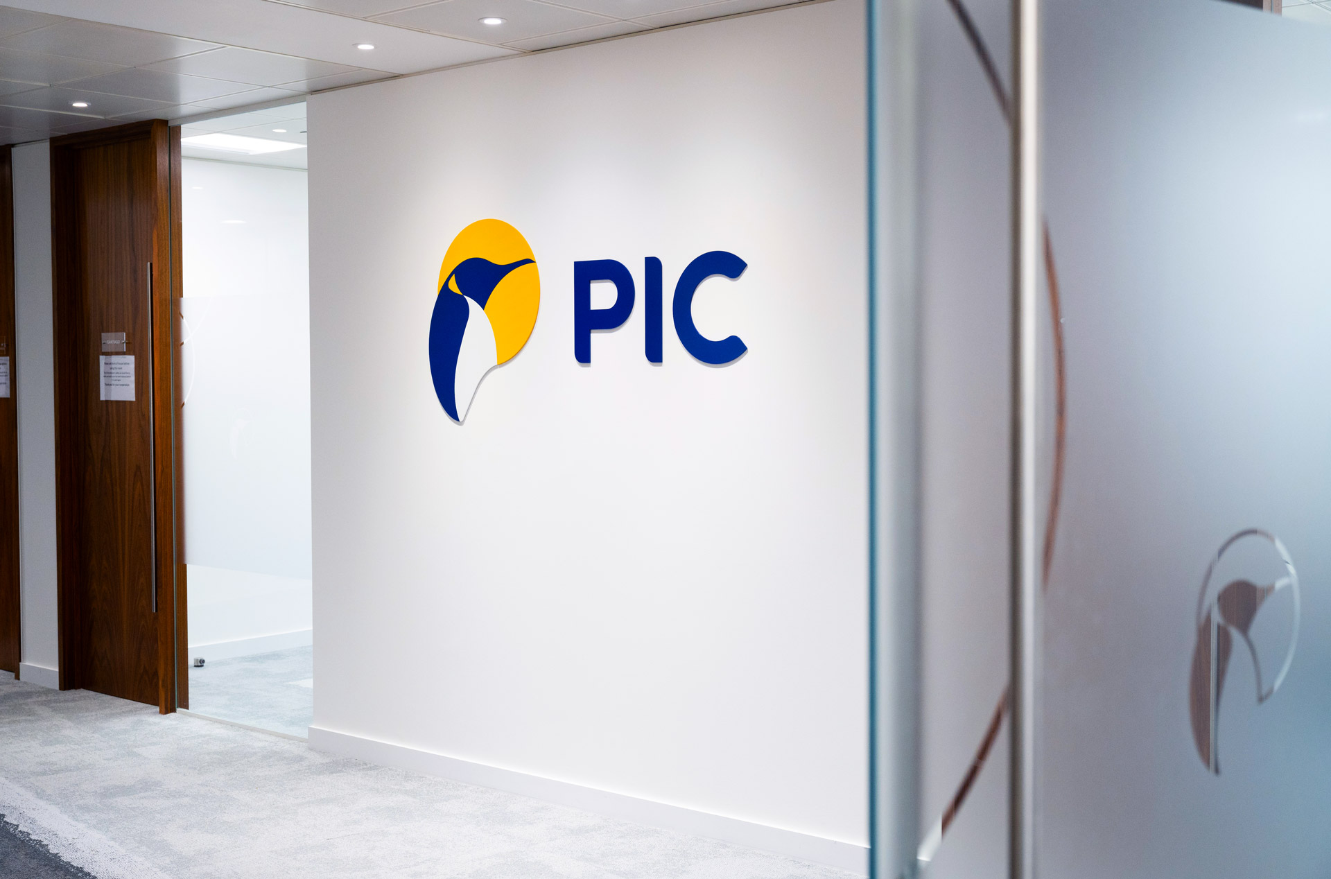 Office branding with branded frosted glass in the foreground